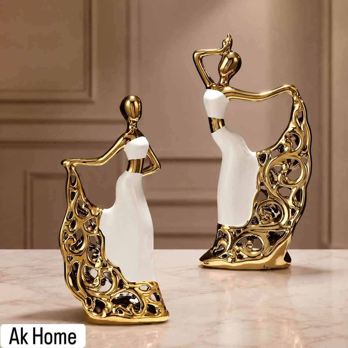Gold & White Dancing Lady Ceramic Figurines – set of 2 on marble surface with gold filigree skirts