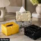 Luxury Ceramic Cheese Tissue Box Cover in Yellow, Silver, and Black displayed on a marble surface