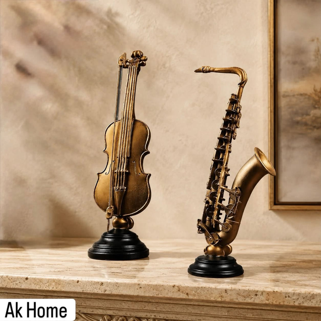 Antique Gold Violin and Saxophone Resin Sculptures on Black Pedestal Bases