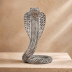 Cobra King Resin Sculpture – antique silver hooded cobra figurine on travertine surface