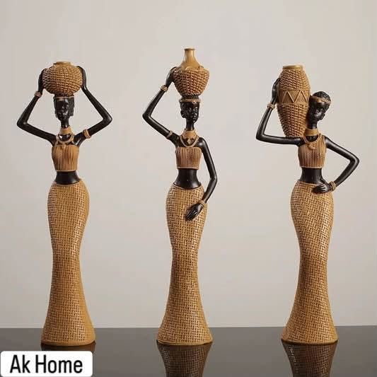 Set of three luxury African woman resin figurines in golden woven gowns balancing vessels on their heads