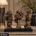 Luxury Bronze Resin Face Sculptures – See No Evil, Hear No Evil, Speak No Evil set displayed on a marble surface