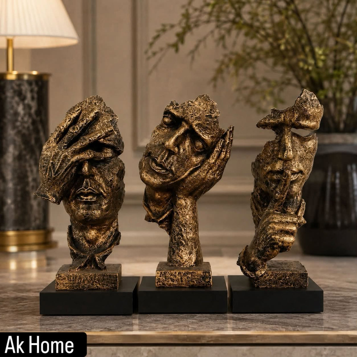 Luxury Bronze Resin Face Sculptures – See No Evil, Hear No Evil, Speak No Evil set displayed on a marble surface