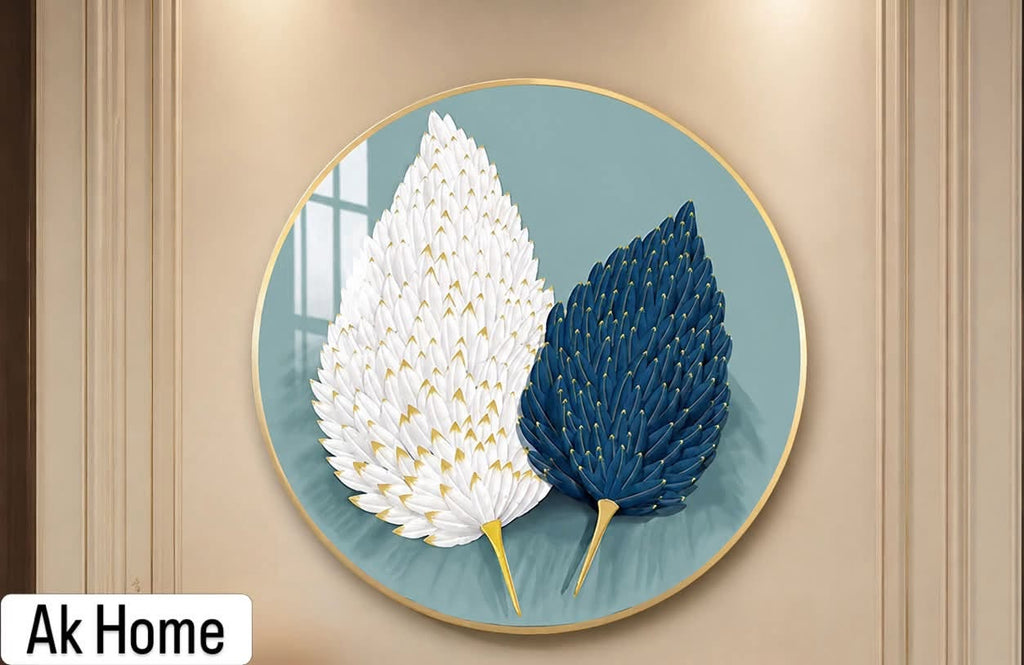 Dual Feather Leaf Round Wall Art – white and navy blue feather leaves on teal background in round gold frame on beige wall