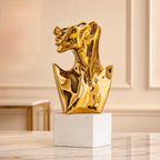 Abstract Face Bust Vase Sculpture – polished gold resin bust on white marble base
